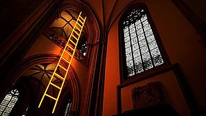 photograph of interior of cathedral, highlighting a ladder