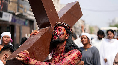 Photo of reenactment of Jesus carrying the cross